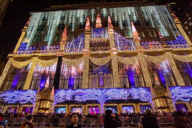 Crowds gather around Rockefeller Center to see Saks Fifth Avenue's dazzling Frozen holiday lights and window display